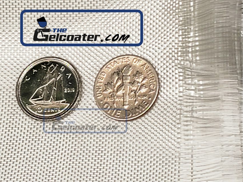 a fully zoomed in photo of a piece of folded 3.25 ounce per square yard fiberglass cloth with 2 dimes on it to show the tightness of the weave with The Gelcoater.com logo